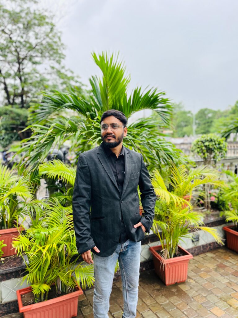 a man standing in front of plants